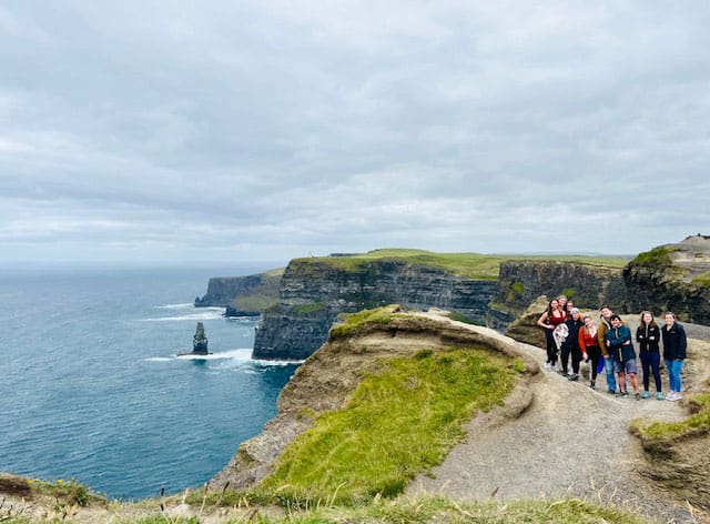 Students gather by the Cliffs of Dover near Dublin, Ireland.